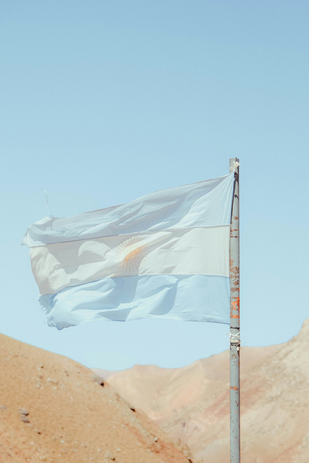 The Argentine flag waving against the sky